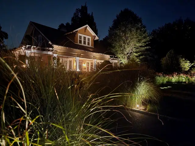 Night shot of a home with Thraxel permanent lighting