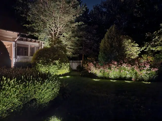 Residential install with roofline and gable lighting at night