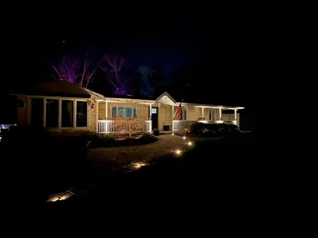 Commercial property facade with zone lighting after dark