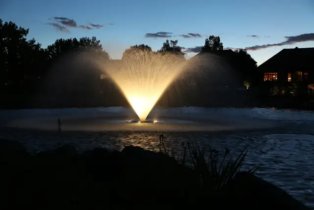 Fountain feature lit with architectural lighting